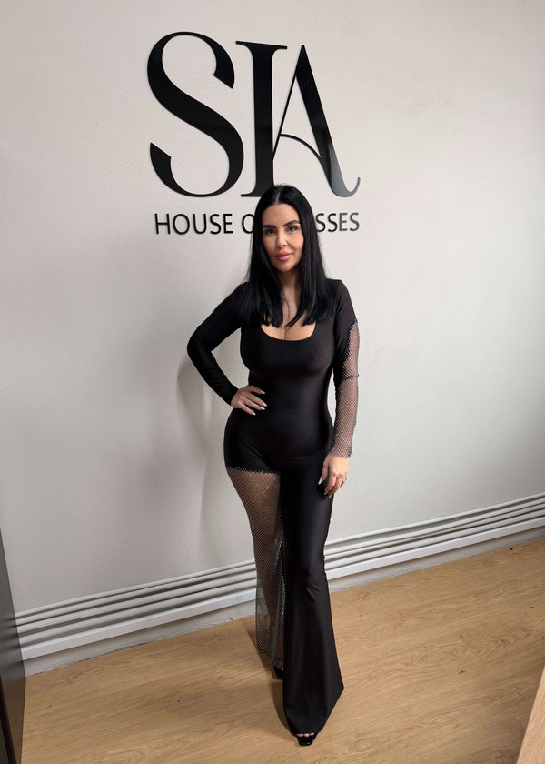 Salopetă neagră din lycra cu inserții din plasă strălucitoare la SIA House of Dresses.