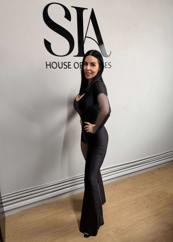 SIA Salopetă neagră din lycra cu inserții din plasă strălucitoare prezentată de model